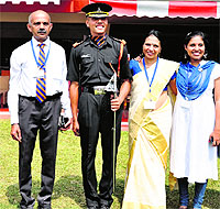 Sword of Honour awardee Vishnu Peetambaram with his family after the passing-out parade held at the IMA in Dehradun on Saturday.