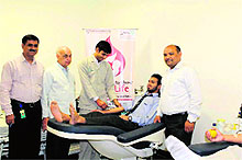A student donates blood at a blood donation camp held at Max Hospital in Dehradun on Sunday.