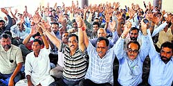 Members of the National Mazdoor Conference stage protest in support of their long-pending demands in Jammu on Sunday