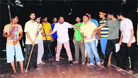 Theatre artistes rehearse along with Kewal Dhaliwal during a workshop at Virsa Vihar in Amritsar on Monday.