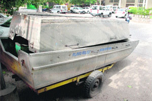 Boats lie in the open in the parking area of the Mini-Secretariat in Panchkula. 