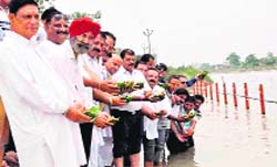 People offer deep dan at the Ganga in Haridwar on Monday. 
