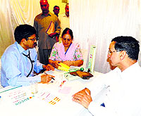 Dr PC Negi, Head of the Cardiology Department, IGMC, Shimla, examines patients at a camp in Sundernagar on Sunday.