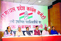 HPCC chief Sukhwinder Singh Sukhu presides over the state executive bodys meeting at the Congress office in Shimla on Monday.
