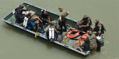 A search operation in progress in Thalot, Mandi, on Monday.