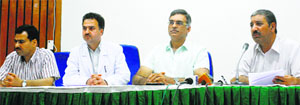 Leading doctors from the UK address mediapersons during a press confrence at SKIMS in Srinagar on Monday.