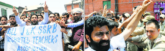 Members of the All-Jammu and Kashmir Service Selection Recruitment Board Teachers Association stage a demonstration against the state government, demanding to fulfill their long-pending demands and regularise their service; and (right) a police officer stops a member of the Jammu and Kashmir Central Non-Gazetted Electrical Employees Union as they stage a protest in Srinagar on Monday.