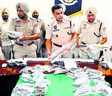 Police officials show the explosives and weapons recovered from the Abohar branch canal at a press conference in Ludhiana on Monday