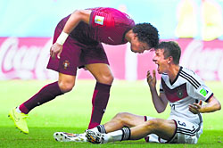 Portugal's Pepe headbutts Germany's Thomas Mueller (L), receiving him a red card, during their match in Salvador on Monday.