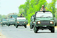 A Pakistani Army convoy heads towards North Waziristan in Bannu district on Monday.