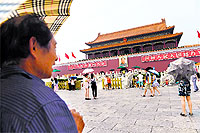Tourists visit Tiananmen Square near the site of a suicide attack which left five persons dead last October, in Beijing on Monday. 