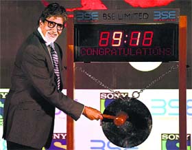 Bollywood actor Amitabh Bachchan rings the bell at the Bombay Stock Exchange during a promotional event in Mumbai on Tuesday