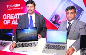 Toshiba India country head Sanjay Warke (L) and VP (PC business) Sivakumar at the launch of new laptop range in New Delhi on Tuesday. It includes the worlds first ultra HD 4K laptop with touch screen and Satellite L Series portable laptops. The entire range is priced between ~25,785 and ~51,340.