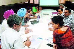 Chief Parliamentary Secretary Sarup Chand Singla and ADC Sonali Giri during a meeting with the Health Department officials in Bathinda