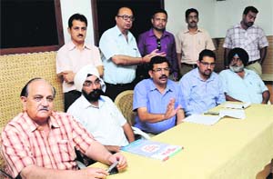 Tenants of SCOs 117 and 118 hold a press conference in Sector 27, Chandigarh, on Tuesday. 