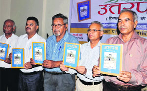 Dignitaries release Uttarpaksh in Dehradun on Tuesday.