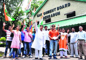 Members of the Uttarakhand Congress Commite protest at the Cantonment Board office in Dehradun on Tuesday.