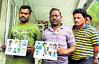 Relatives of the Beas tragedy victims show pictures of missing students at Pandoh in Mandi on Tuesday. 