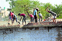 Acquired properties being demolished for the construction of the Chandan Nagar RUB in Jalandhar on Tuesday. 