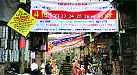 Banners put up by market associations regarding closure of shops for summer break in Jalandhar on Tuesday.
