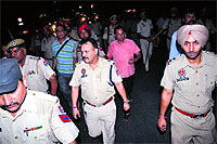 Policemen at the place where the violent incident took place. 