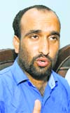 Bhupinder Singh, senior vice- chairman of the Rehbar-e- Taleem (ReT) Teachers Forum, addresses a press conference in Jammu on Tuesday.