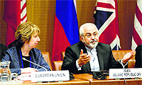 The European Union Foreign Policy Chief (L) and Iranian Foreign Minister in Vienna on Tuesday.