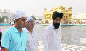 Jalandhar Deputy Commissioner Kamal Kishore Yadav (left), who took additional charge of Amritsar, pays obeisance at the Golden Temple on Wednesday.