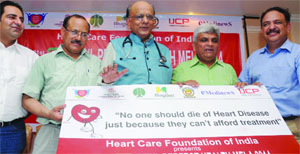 Heart Care Foundation of India president Dr KK Aggarwal (C) with other officials announces the theme of the forthcoming MTNL Perfect Health Mela 2014, at a press conference in New Delhi on Wednesday.