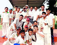 Members of the Himalayan Cricket Academy pose with the Parash Ram Memorial T20 Cricket Tournament trophy in Dehradun on Wednesday.