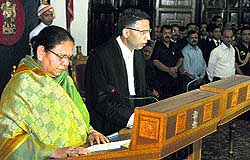 Governor Urmila Singh administers the oath of office to Justice Mansoor Ahmad Mir as the Chief Justice of HP High Court in Shimla on Wednesday
