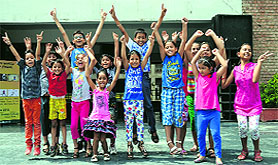 Children dance during the two-week summer camp organised at Lovely Professional University near Jalandhar. 