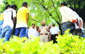 Police officials discuss the side-effects of drugs with addicts in Ludhiana on Wednesday. 