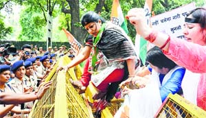Congress women activists protest against Union Minister Nihalchand Meghwal outside the BJP headquarters in New Delhi on Wednesday.