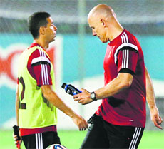 Howard Webb (right) must be finding his police training quite handy in maintaining law and order on the football field. 