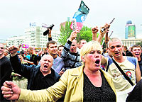  People shout for independence during a rally in support of the self-proclaimed Donetsk Peoples Republic in Donetsk, eastern Ukraine, on Wednesday. 