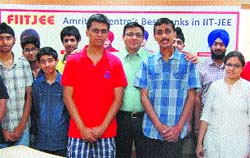 Saksham Sharma (centre) of FIIT-JEE centre in Amritsar on Thursday.