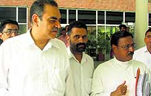 City BJP president Sanjay Tandon and senior party leader Satya Pal Jain walk out of the AAC meeting at the UT Guest House in Chandigarh on Thursday