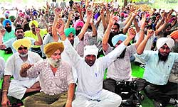 Members of the Chandigarh Government Transport Workers Union hold a gate rally in support of their demands at the CTU workshop in Sector 25, Chandigarh, on Thursday