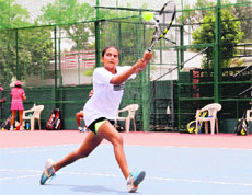 A player in action during the All-India Super Series Tennis Tournament in Dehradun on Thursday.