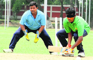 A visually-impaired sportsperson plays a shot during a cricket match at the Doon School in Dehradun on Thursday.