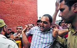 Police detain employees of the J&K Urban Local Bodies who were protesting against the state government in favour of their long-pending demands in Srinagar on Thursday