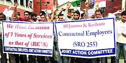 Members of the All-Jammu and Kashmir Contractual Employees Joint Action Committee protest against the state government in Srinagar on Thursday