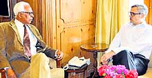 Governor NN Vohra interacts with Chief Minister Omar Abdullah at Raj Bhawan in Srinagar on Thursday