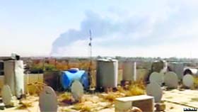 A video footage purportedly shows smoke rising from the Baiji refinery.