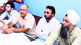 AAP leader Manish Sisodia with MP Bhagwant Mann in Sangrur on Thursday.