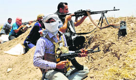 Shiite fighters train in the town of Taza, south of Kirkuk.