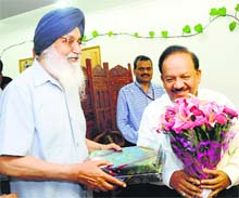 CM Parkash Singh Badal with Union Health Minister Harsh Vardhan in Delhi on Thursday.