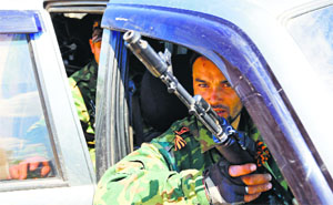 Pro-Russian separatists sit in a car before driving to the battle line in Seversk (Siversk) on Thursday. 
