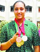 Khalsa College student Navjeet Kaur, who won two medals in the Junior Asian Athletics Meet, returned to her college on Friday in Amritsar.